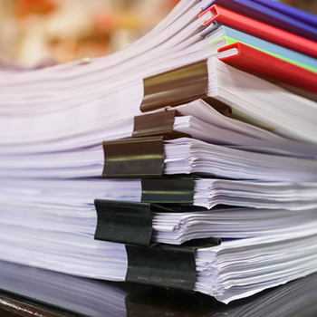 Photo of bound paper stacks.